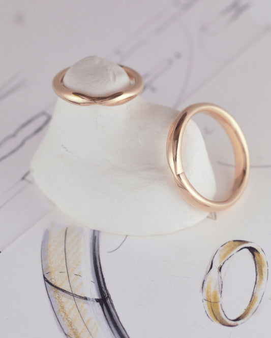 18K yellow gold ergonomic wedding bands with pinch accents