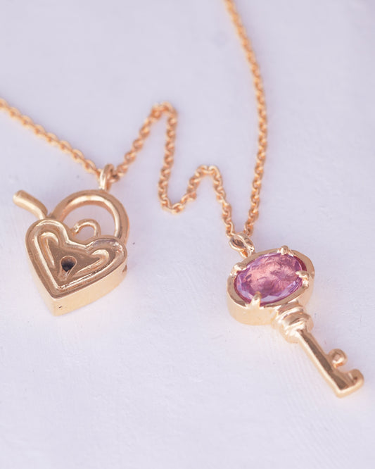18K yellow gold locket and key necklace with padparadscha sapphire